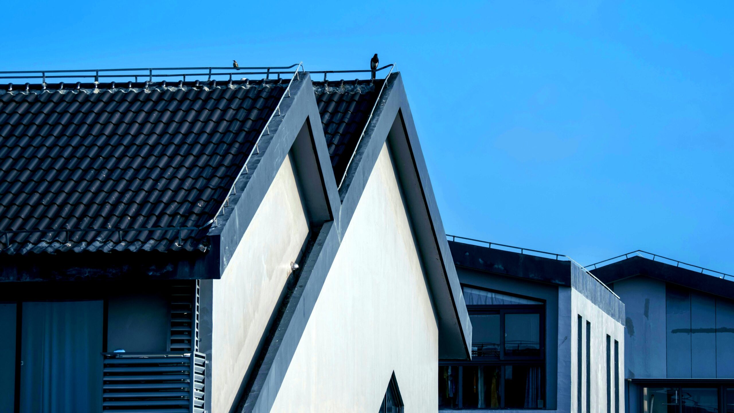 Diagram comparing different style roof options for residential homes including gable, hip, and flat