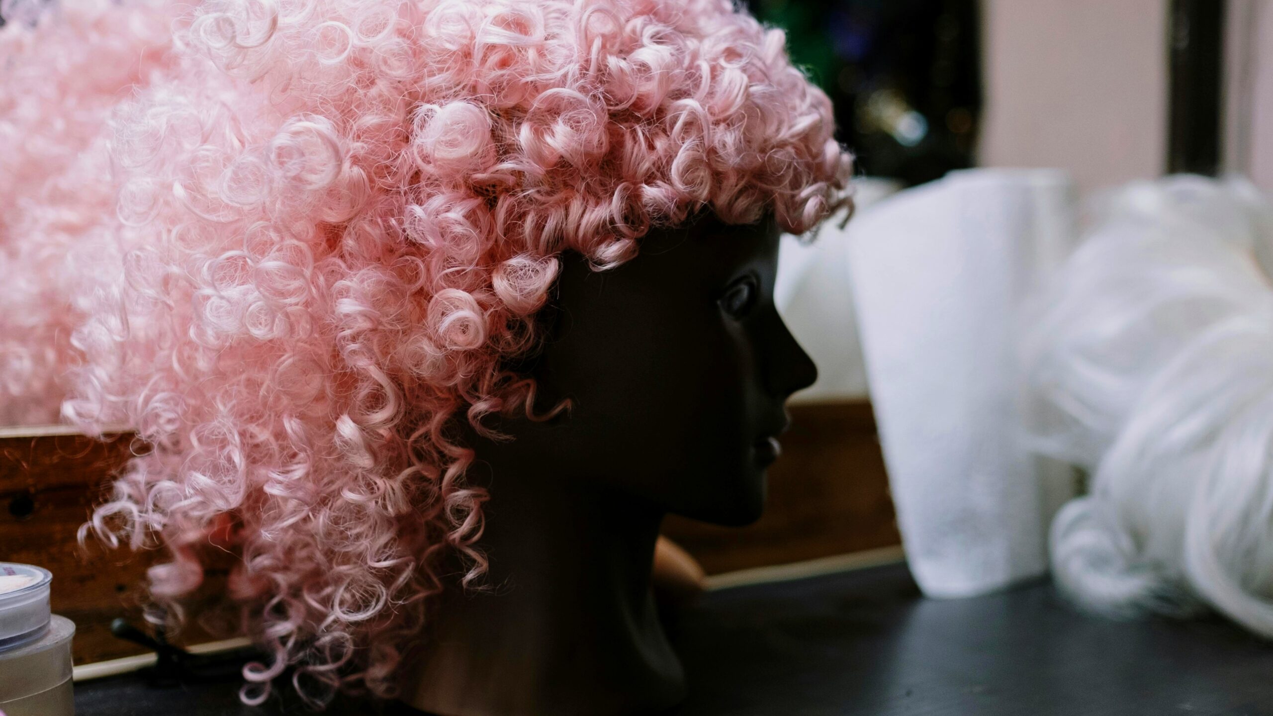 A collection of 1950s style wigs including Beehive, Rockabilly, and Housewife styles for retro costumes
