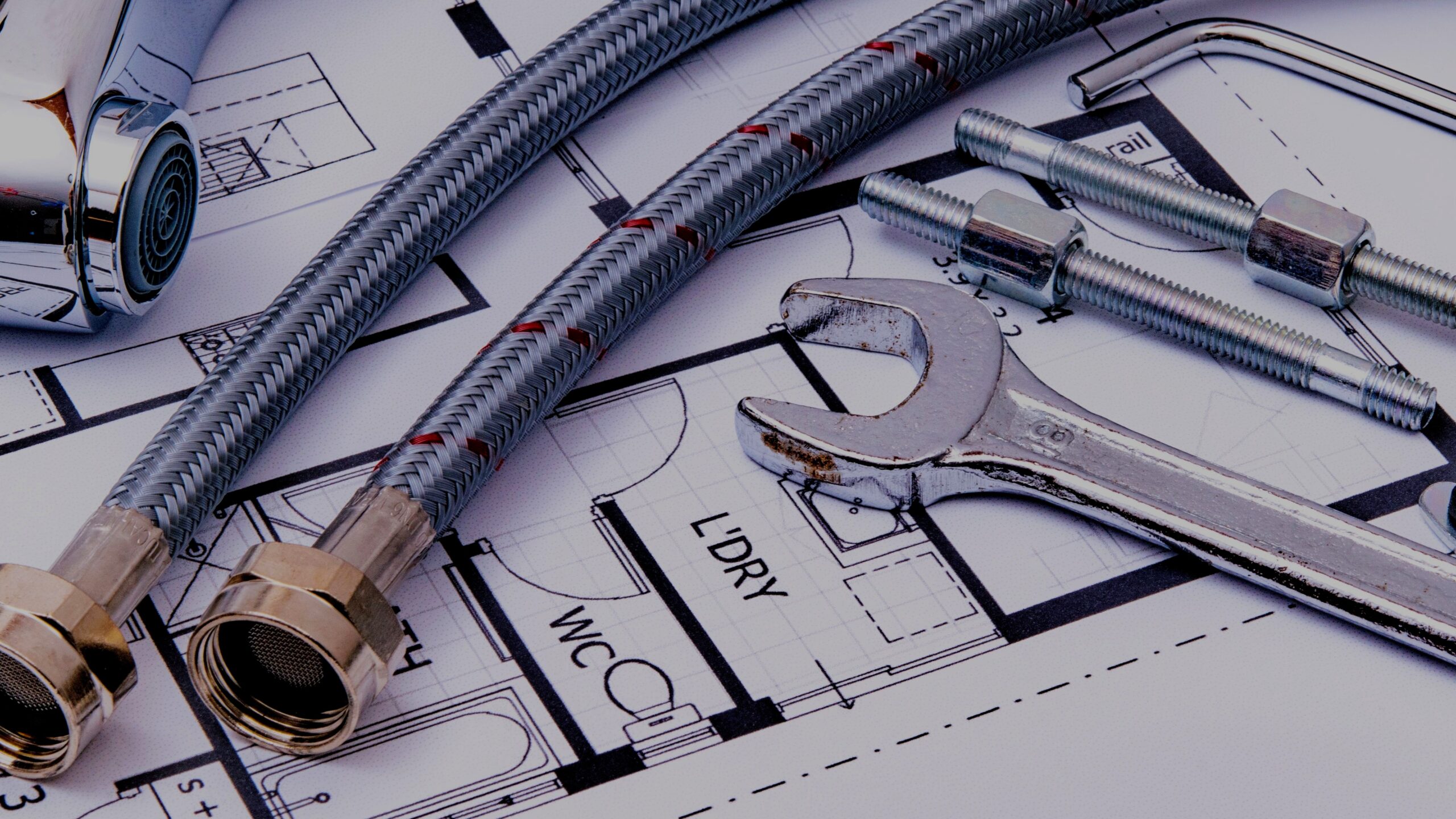 Outdoor faucet repair kit with parts laid out on a workbench